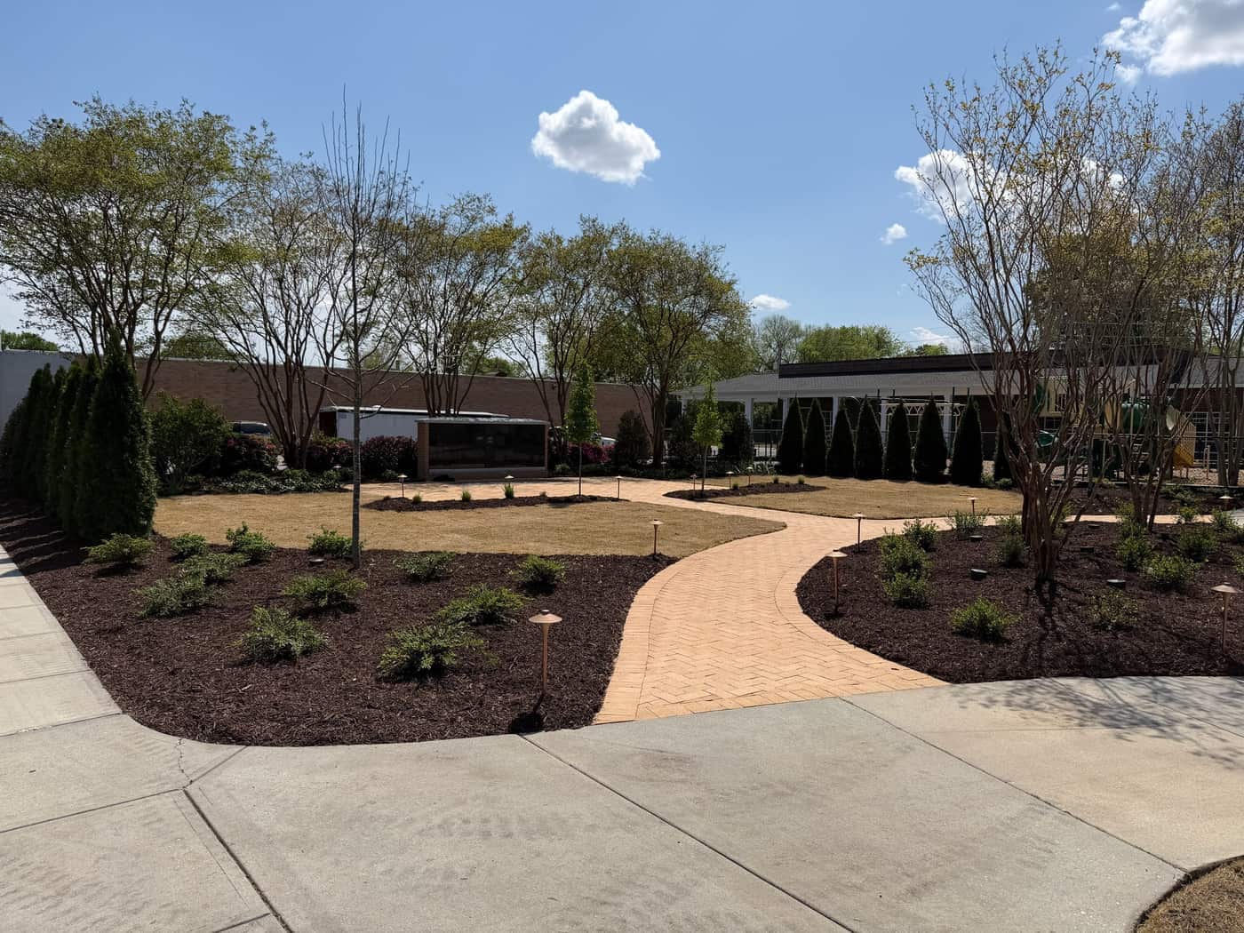Herringbone paver walks and planting on a finished hardscape